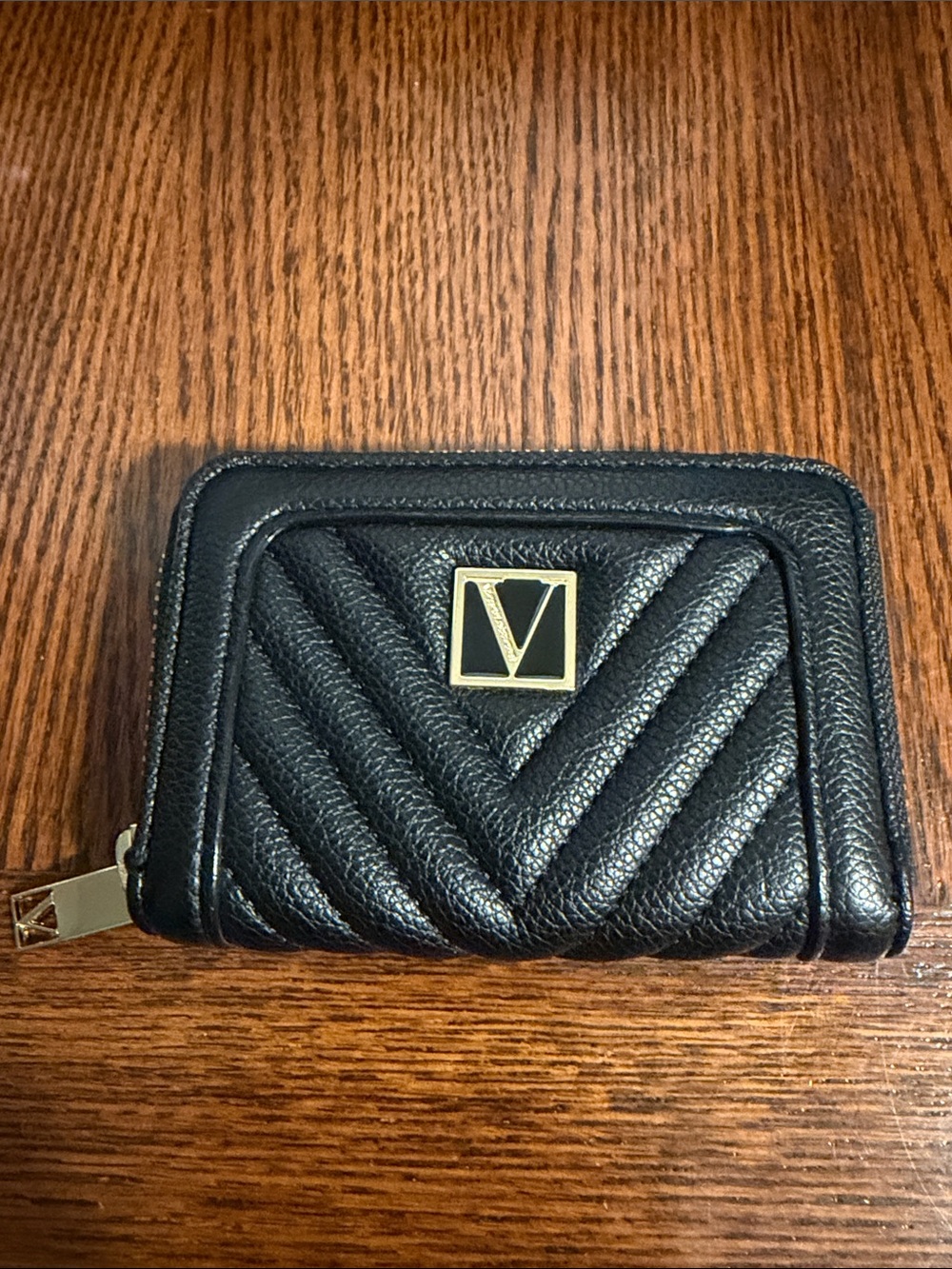 Black Quilted Leather Zip Wallet with Gold Emblem